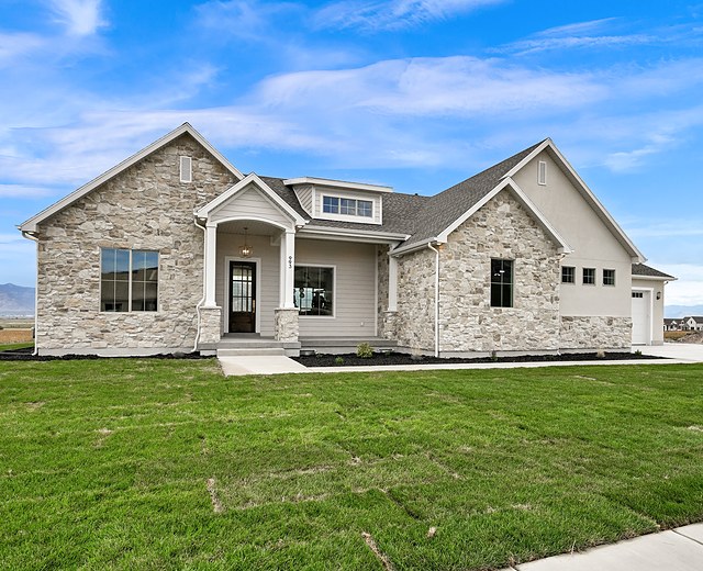 Front of the finished home at 993 N 75 W, Mendon, with stone accents and a covered entry