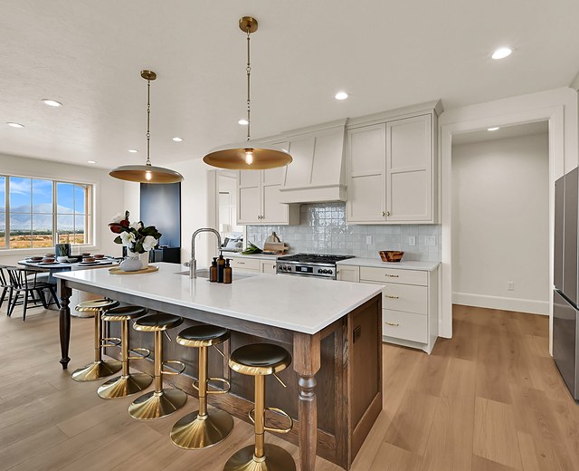 Kitchen with a walnut island, white cabinetry and valley views, 993 N 75 W, Mendon